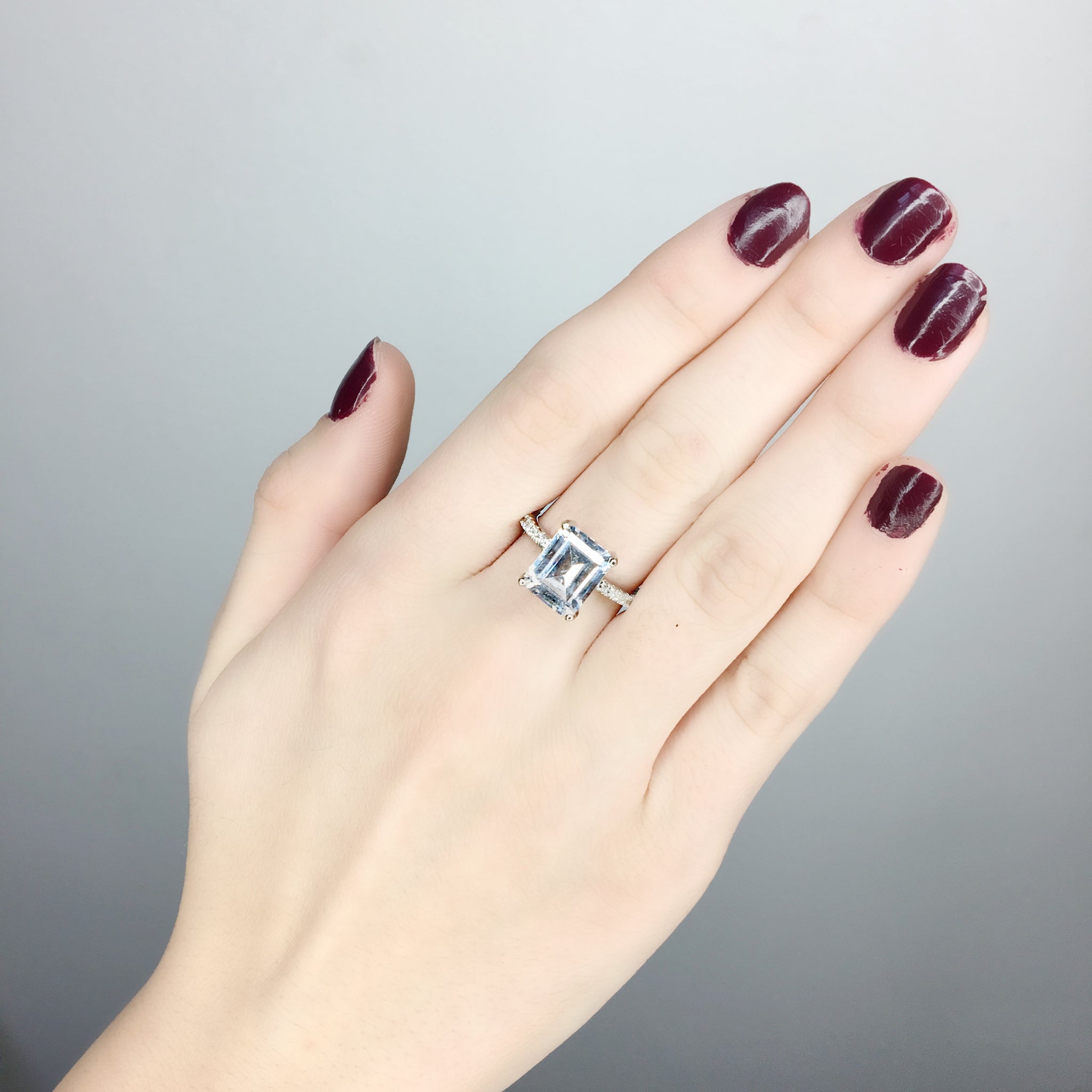 emerald cut solitaire ring on model
