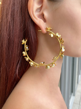Gold Pearl Flower Hoop Earrings close up on model