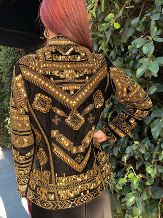 Black and gold tribal beaded velvet jacket back view in sunlight